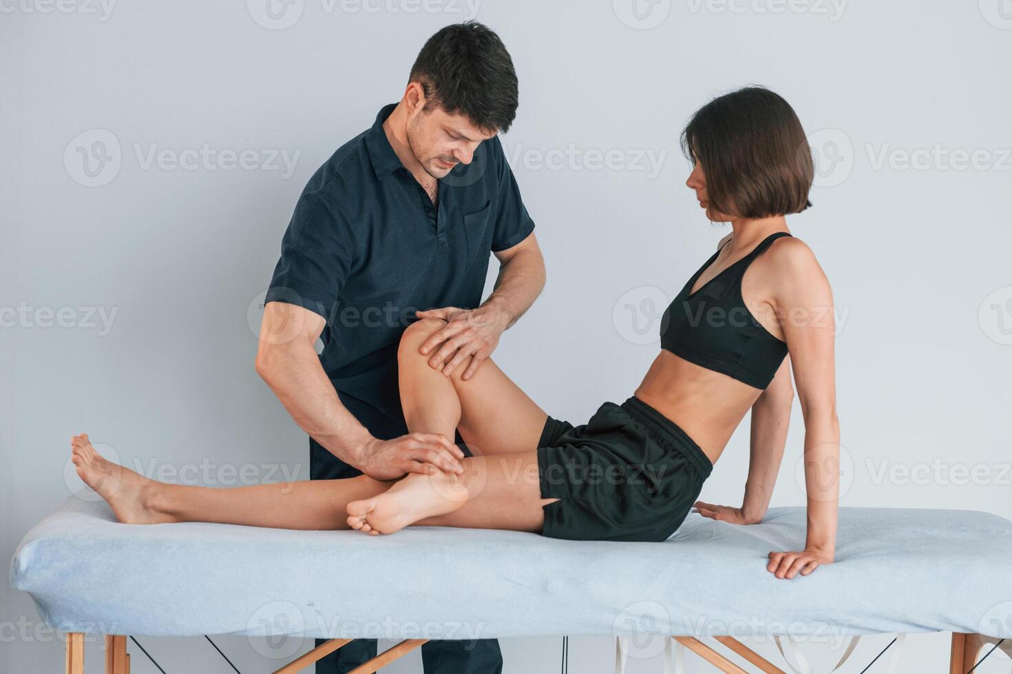 Laying down on a table. Woman visiting physiologist that making massages and helping with traumas photo