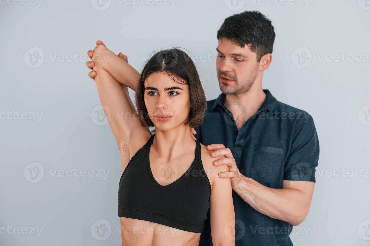 Sitting on the table. Woman visiting physiologist that making massages and helping with traumas, photo