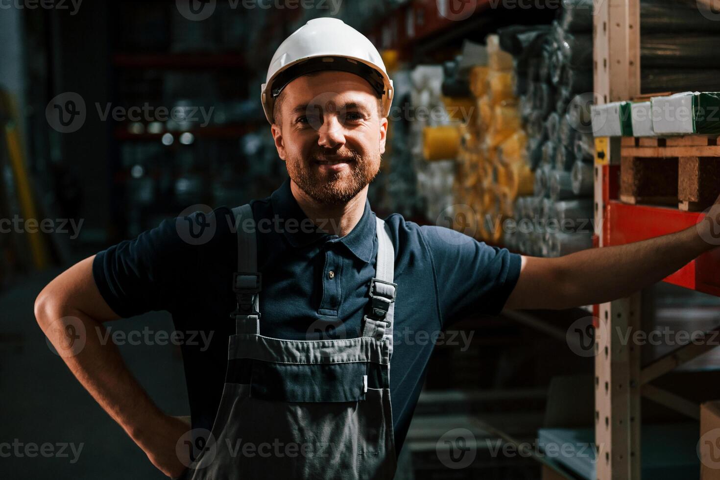In dark store. Employee in uniform is working in the storage., photo