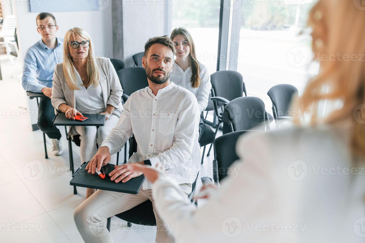 Learning process.. Group of professional business people is in the office photo
