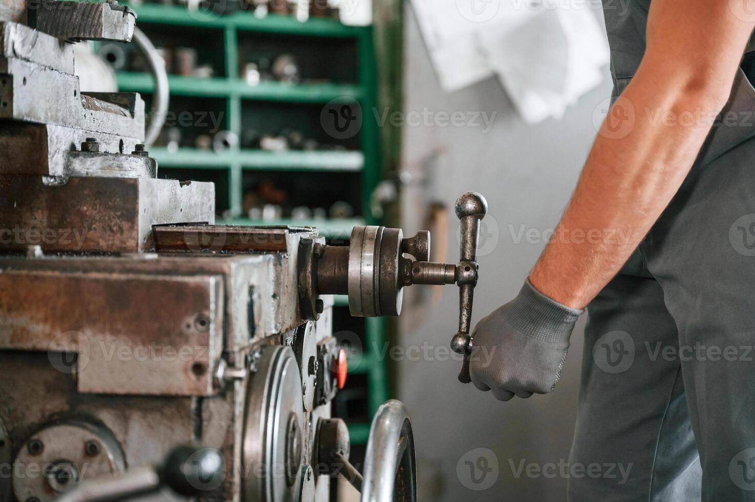 Close up .view. Man in uniform is in workstation developing details of agriculture technique photo