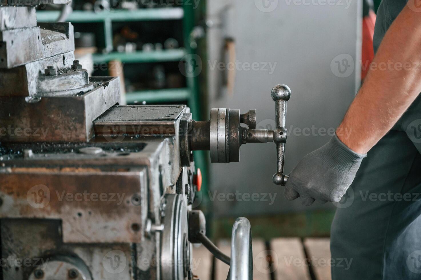 Close up view. Man in uniform is in workstation developing details of agriculture technique photo