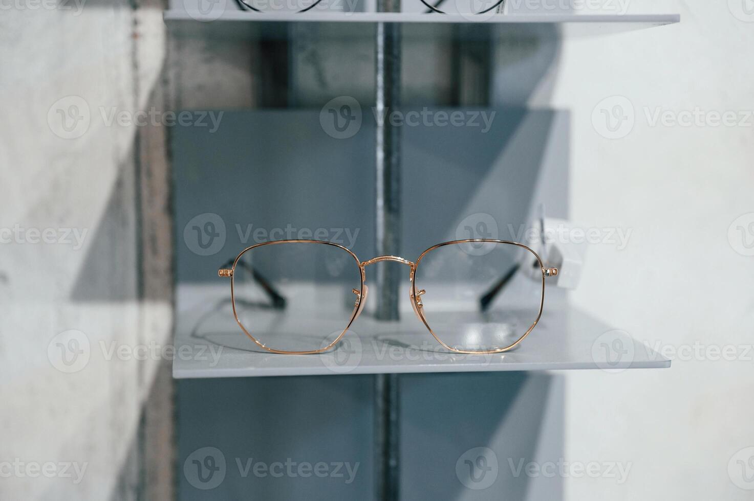 Close up view of glasses that is on the shelves indoors in the store.. photo