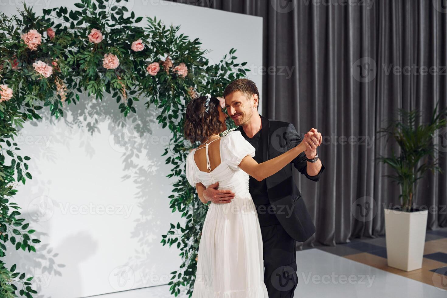 Dancing together.. Beautiful bride with his fiance is on the wedding photo