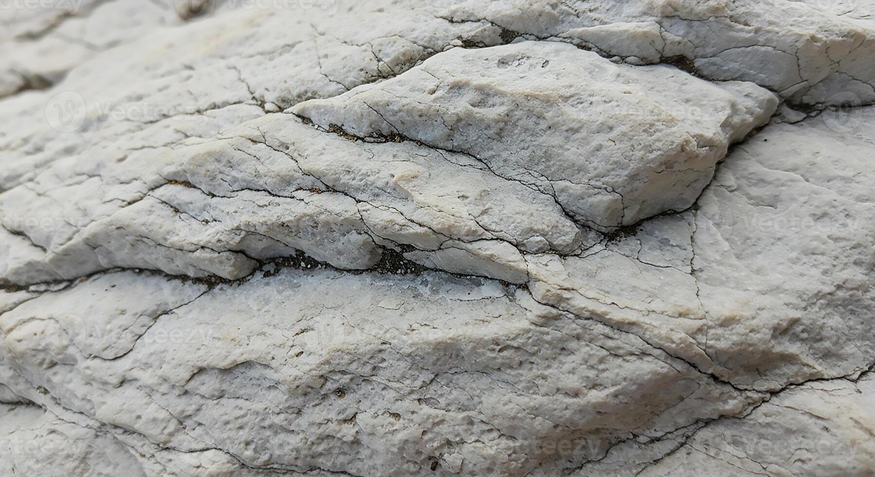 A close up of a rock with some cracks photo