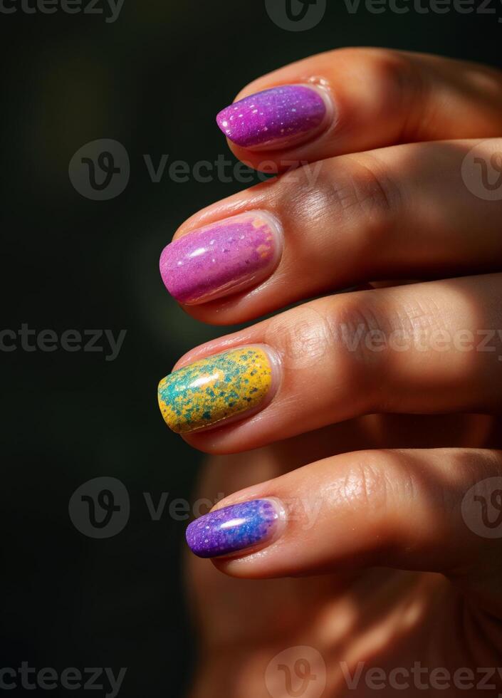 Beautiful female hands with purple and yellow nail polish manicure. Pastel Ombre Nails photo