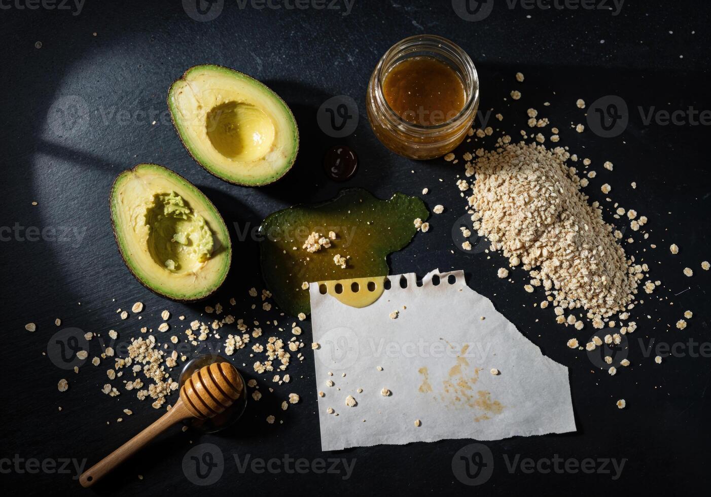 Avocado, sesame seeds and honey on a black background. Avocado Honey Oatmeal photo