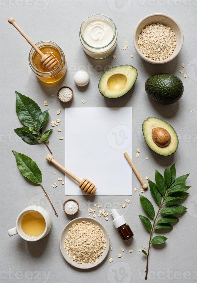 Natural ingredients for healthy cooking on grey background. Top view, flat lay. Natural Avocado Face Mask Recipe photo
