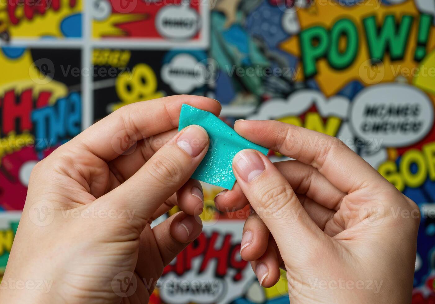teen hands holding a teal peel off nail mask on pop art background. Teal Polymer Clay photo