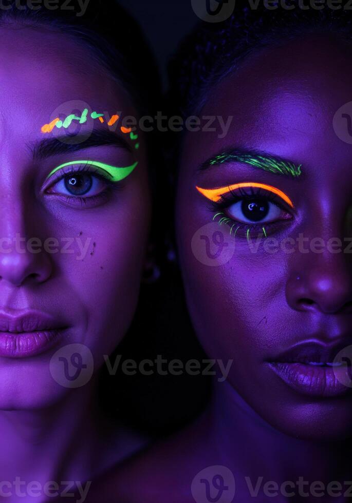 Close-up portrait of two beautiful African American women with fluorescent make-up. Neon Glow Makeup photo