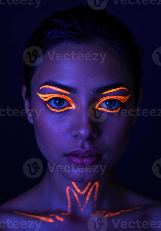 Fashion portrait of young beautiful woman with bright make-up. Neon Body and Face Art photo
