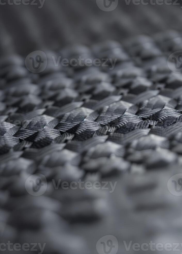 Close up of carbon fiber composite material, industrial background, selective focus. Carbon Fiber Weave Texture photo