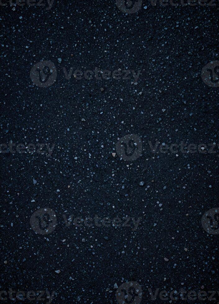 Asphalt background texture with some fine grain and dotty pattern. Dark Asphalt Texture photo