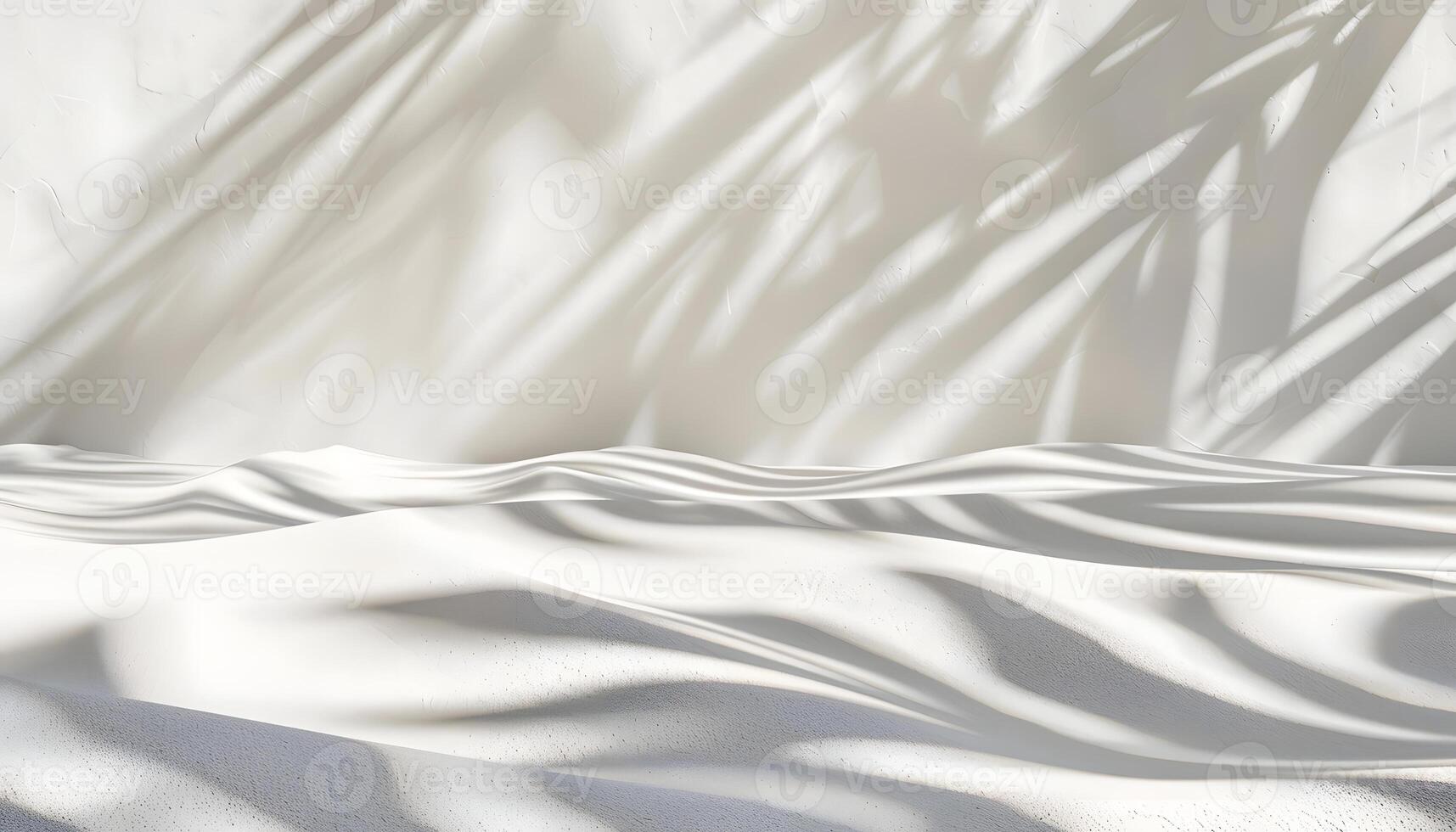 A serene scene of soft white sand with gentle shadows creating a tranquil atmosphere. photo