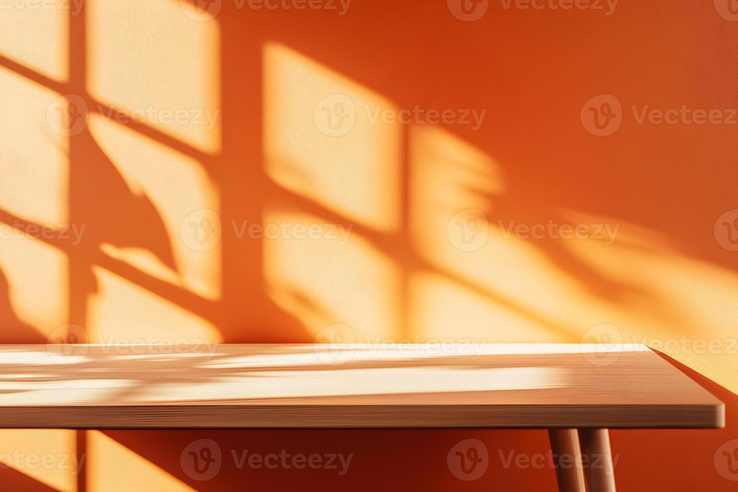 Wooden Table and Orange Wall with Sunlight Shadows photo