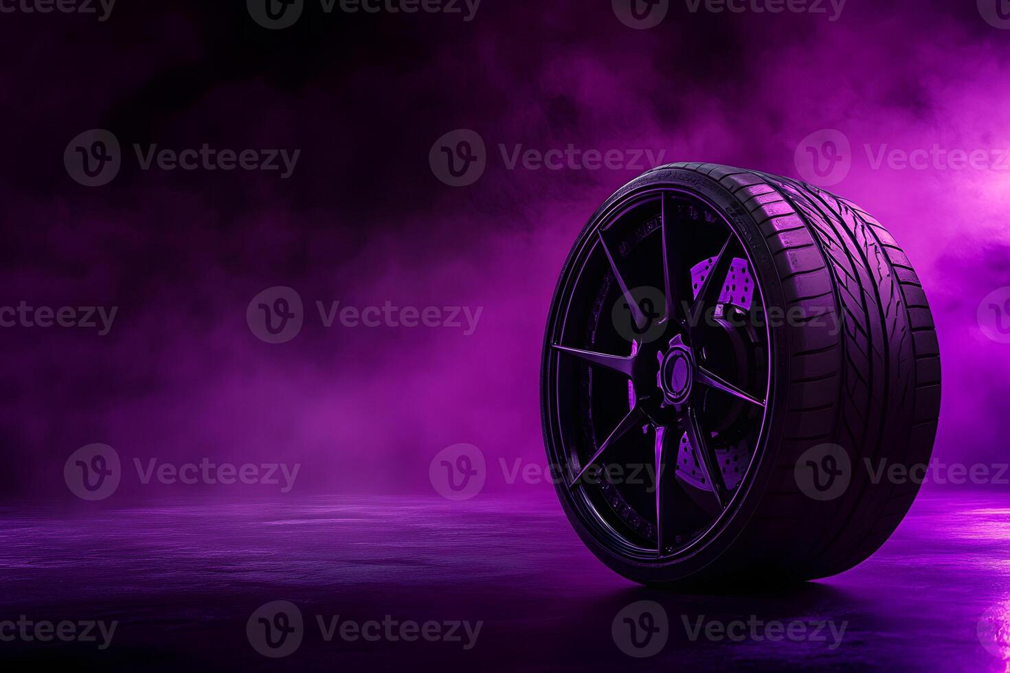 Black Tire and Rim on Purple Smoky Surface photo