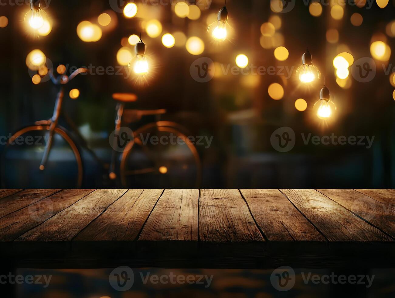 Wooden Table with Blurred Bicycle and String Lights photo