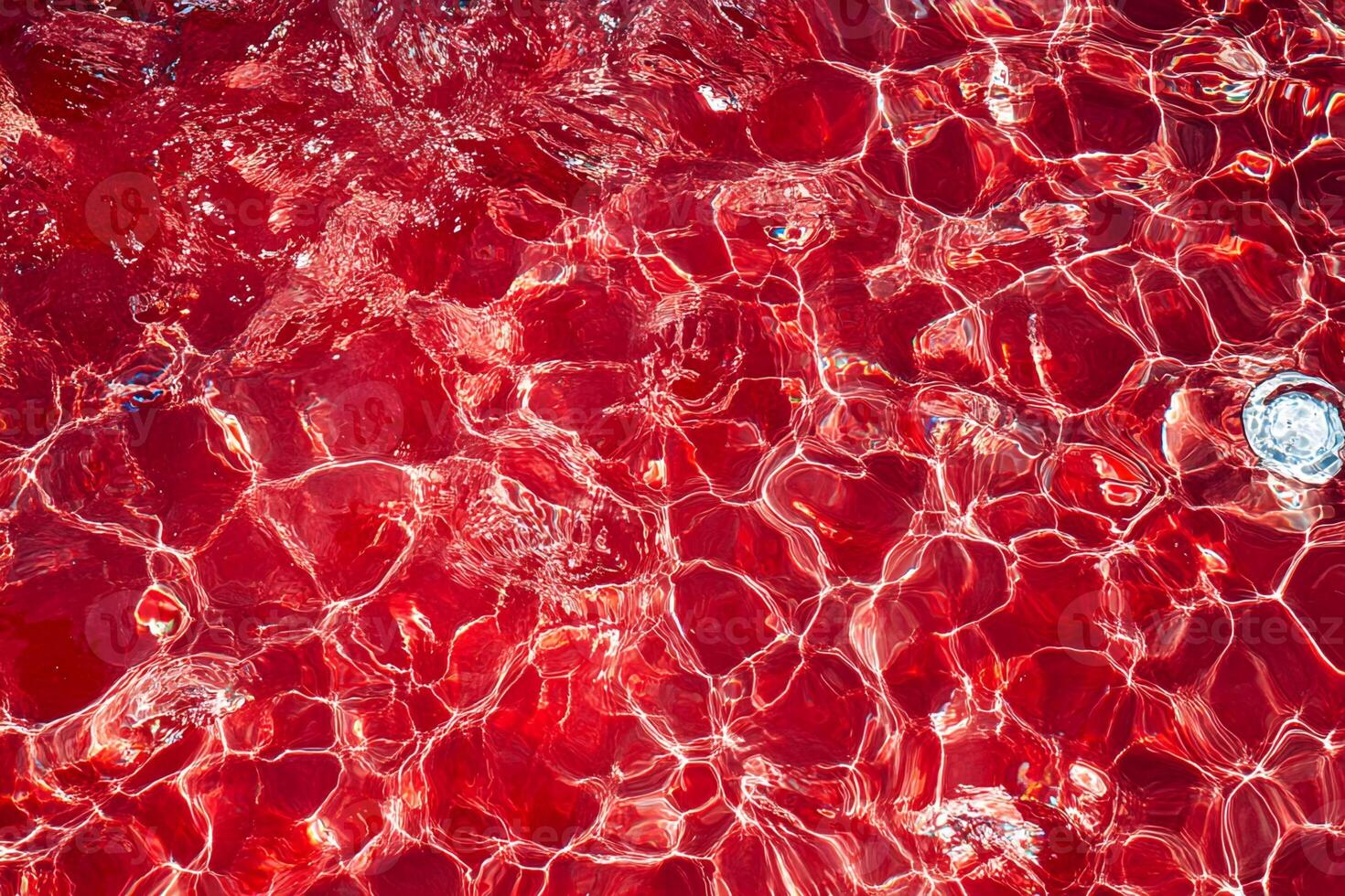 Red Pool Water Surface with Refraction Patterns photo