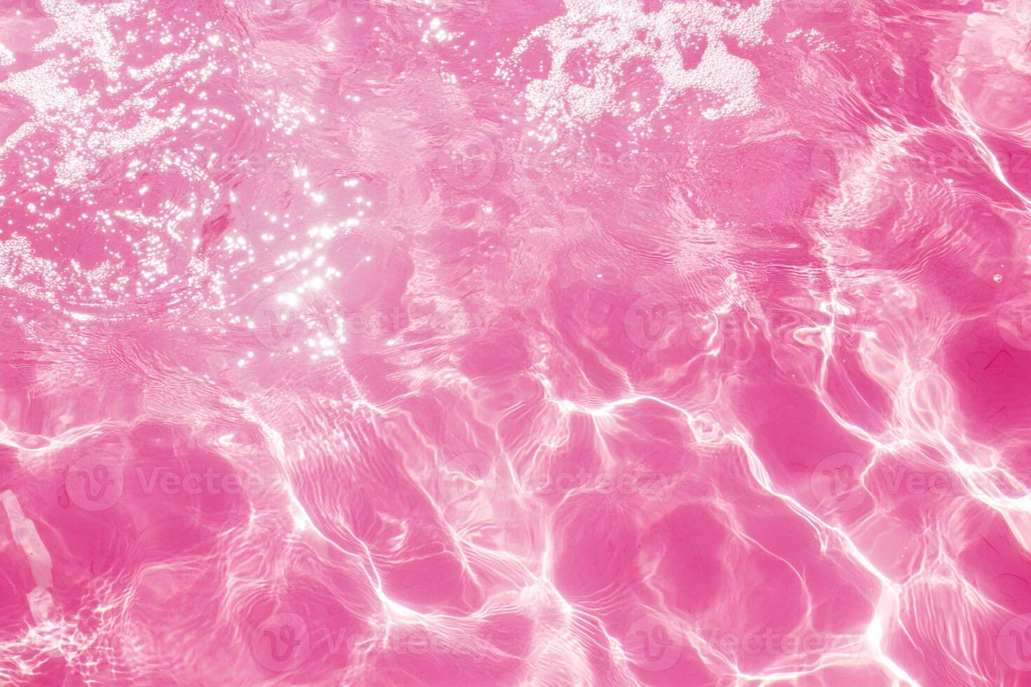 Pink Water Surface with Ripples and Light Reflections photo