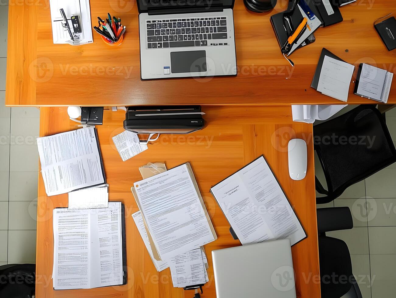 Overhead View of Office Desk with Documents and Laptops photo