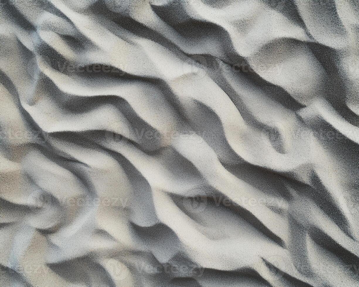 Textured Gray Sand with Undulating Surface Patterns photo