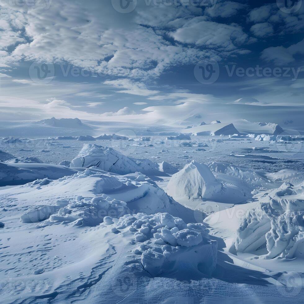 Antarctic Ice Field with Distant Mountains and Cloudy Sky photo