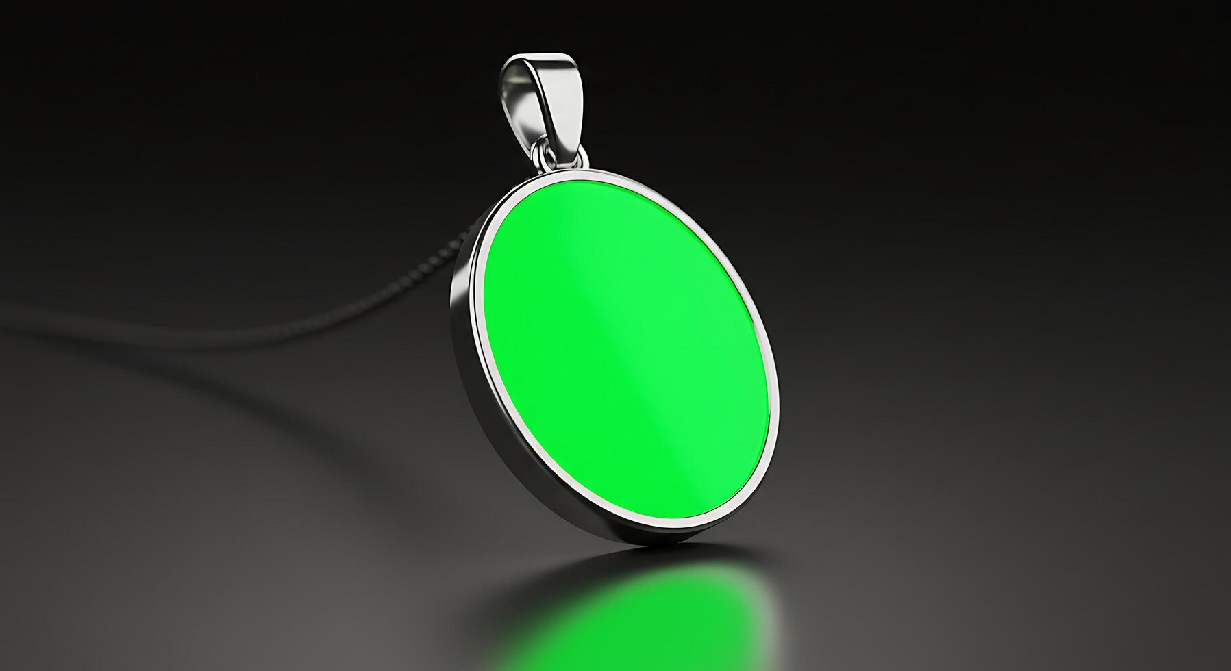 A green pendant with a silver chain photo