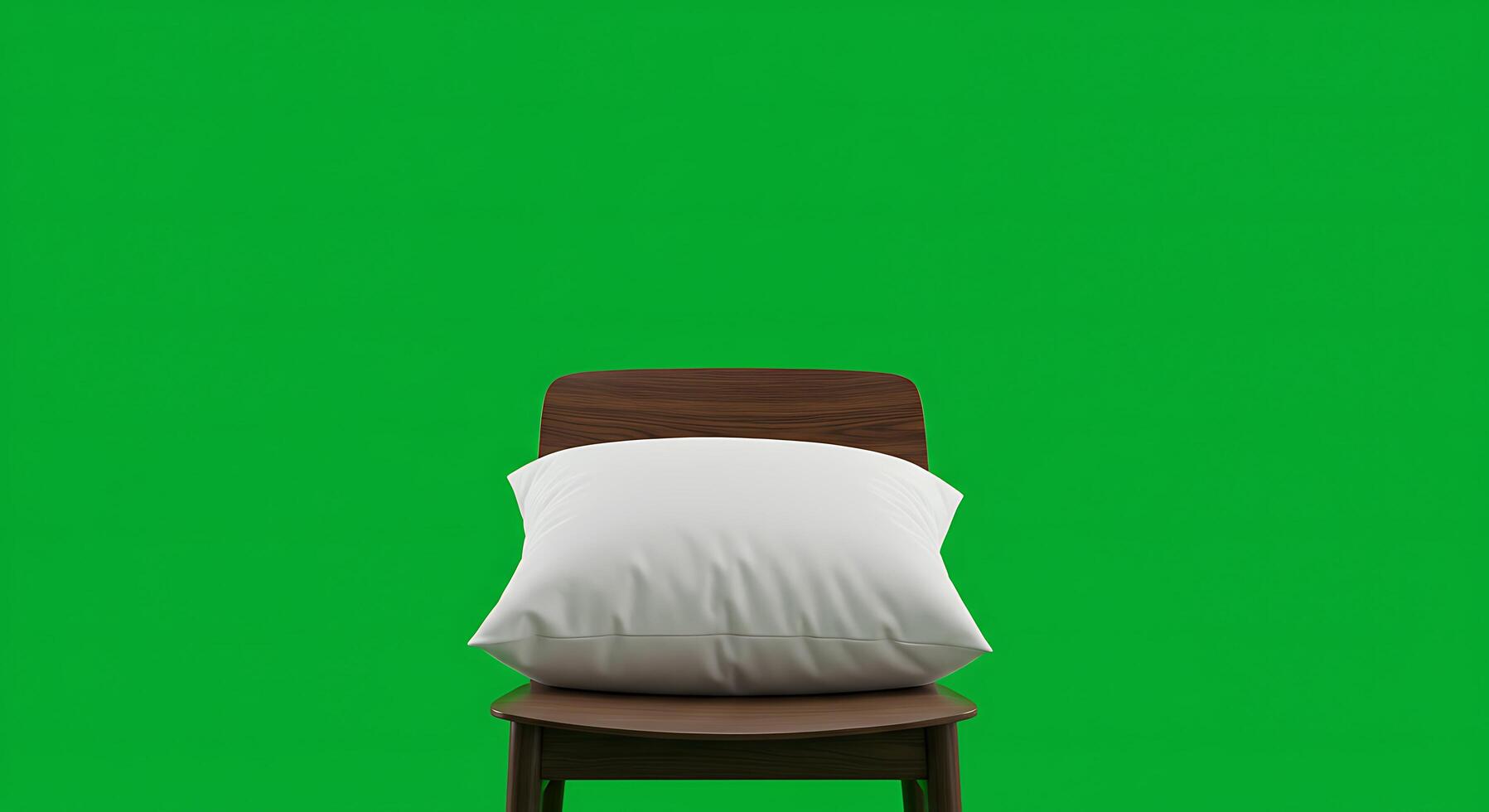 A chair with a pillow on it against a green screen photo