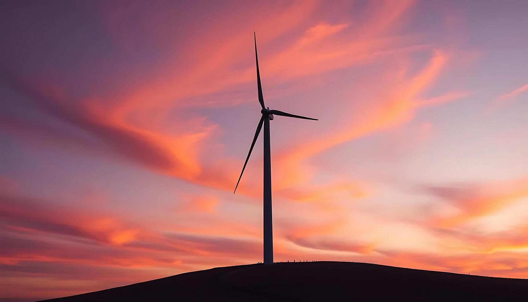 Wind turbine at sunset photo