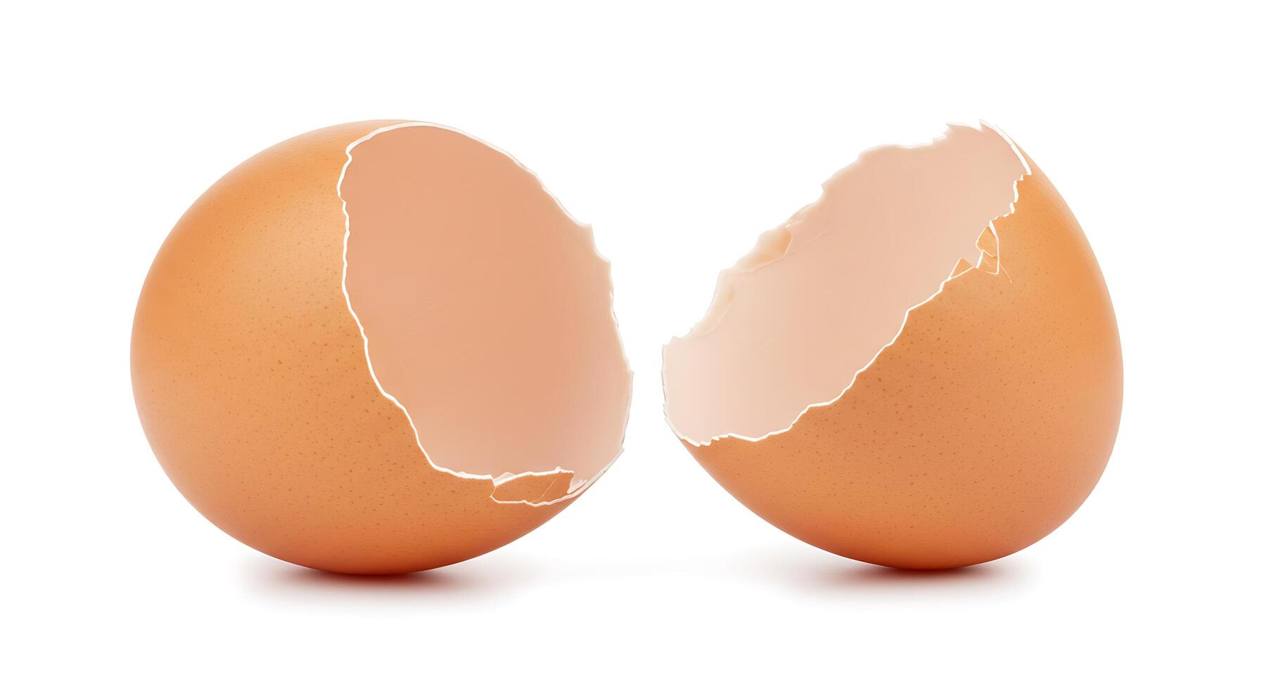 Two brown eggs are shown with one cracked open photo