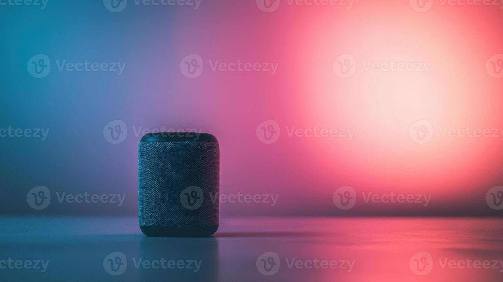 A speaker sitting on a table in front of a colorful background photo