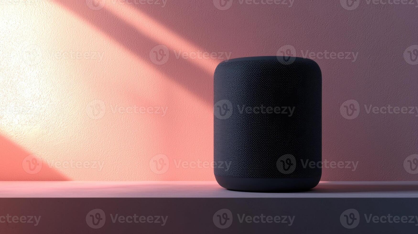 A smart speaker sitting on a table in front of a pink wall photo
