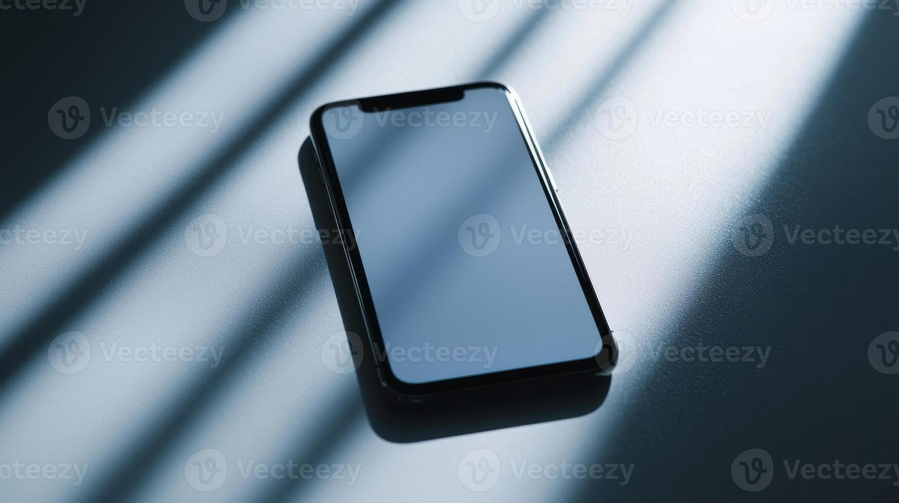 An iphone is shown on a table with shadows photo