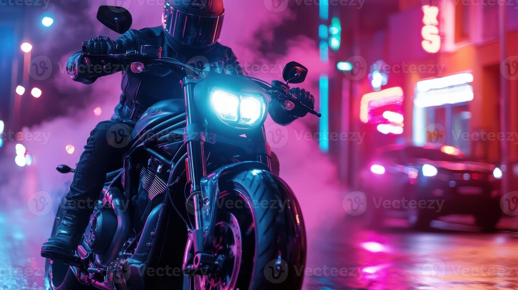 A man riding a motorcycle in the dark at night photo