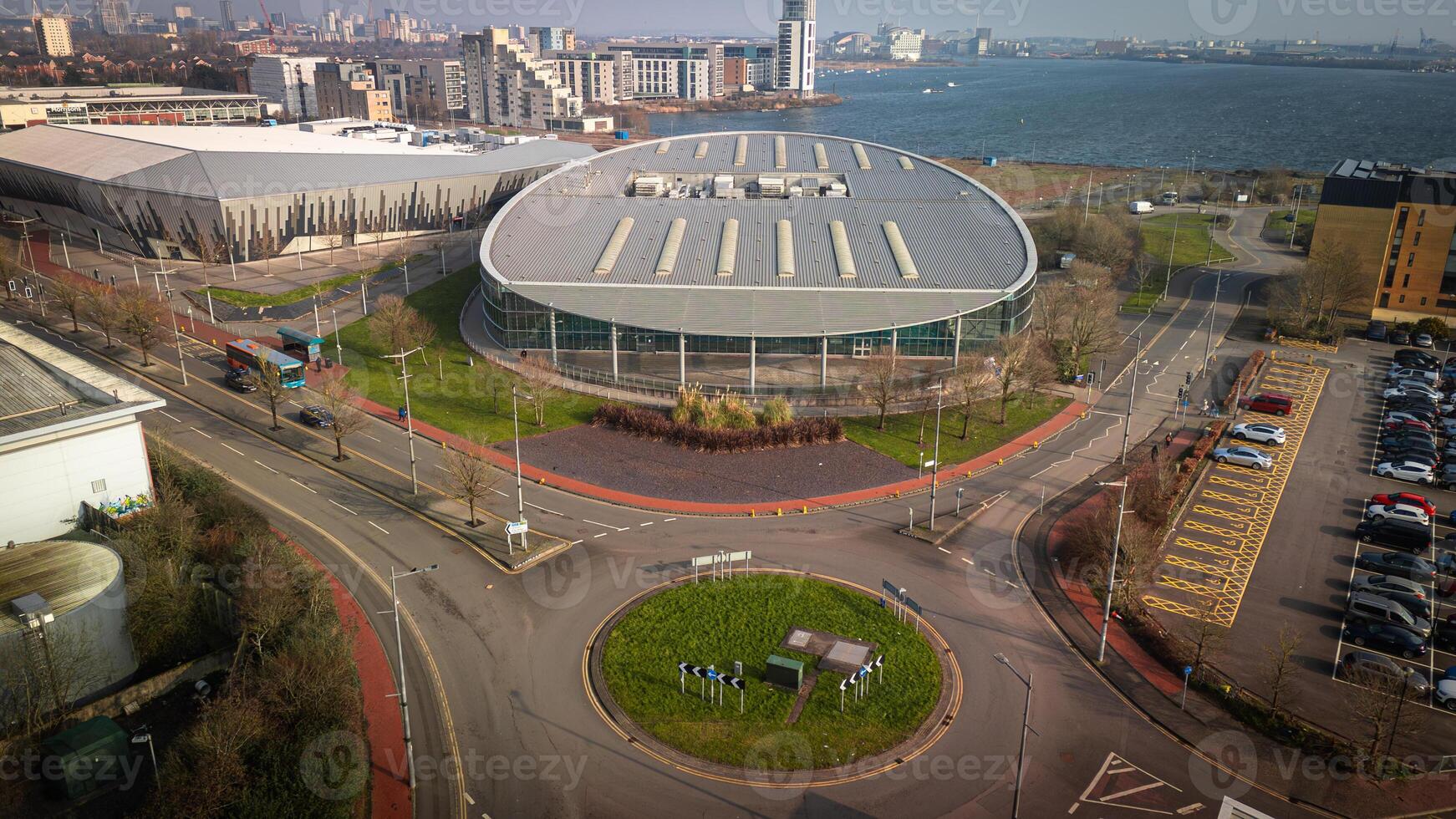 Aerial View of Modern Circular Building Near Waterfront photo