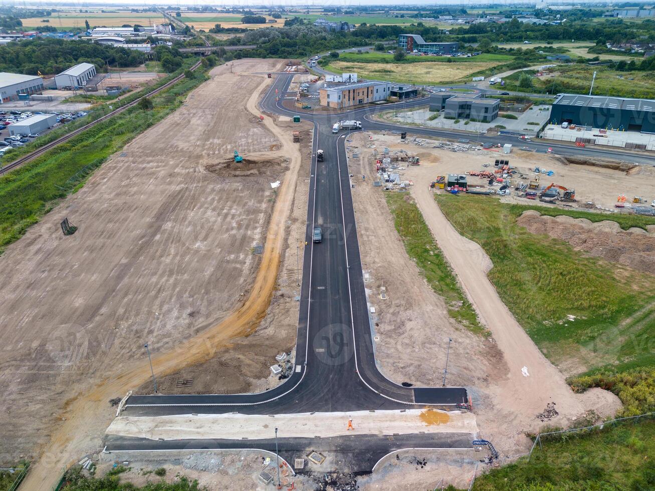Aerial view of road construction site with workers building new infrastructure photo