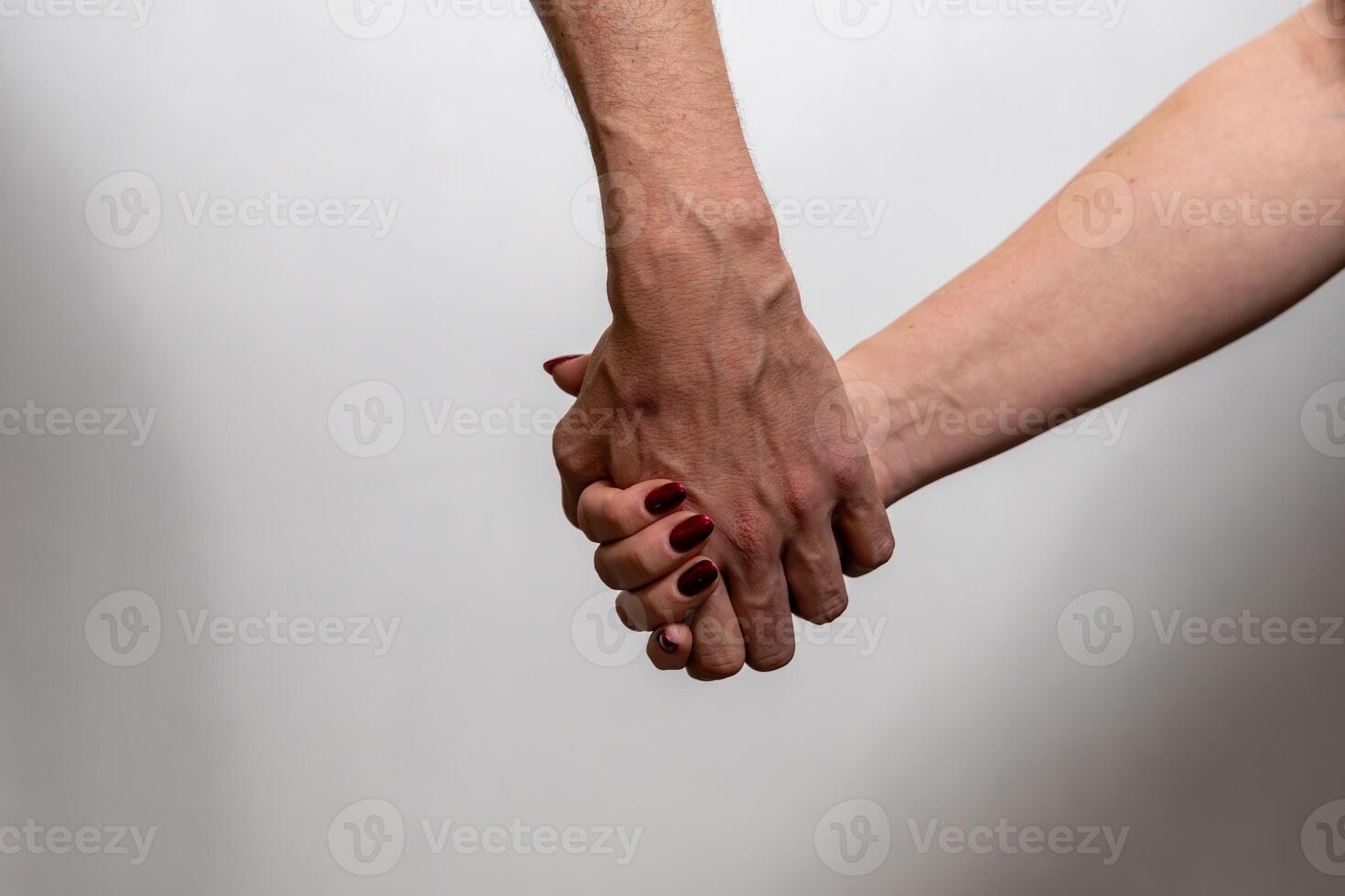 Couple holding hands showing love and support photo
