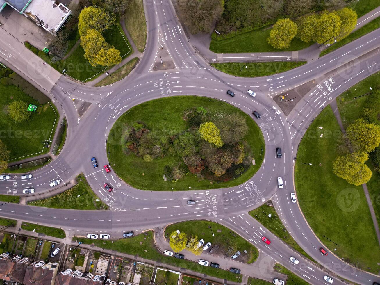 Aerial view of traffic flowing around a roundabout in a residential area photo
