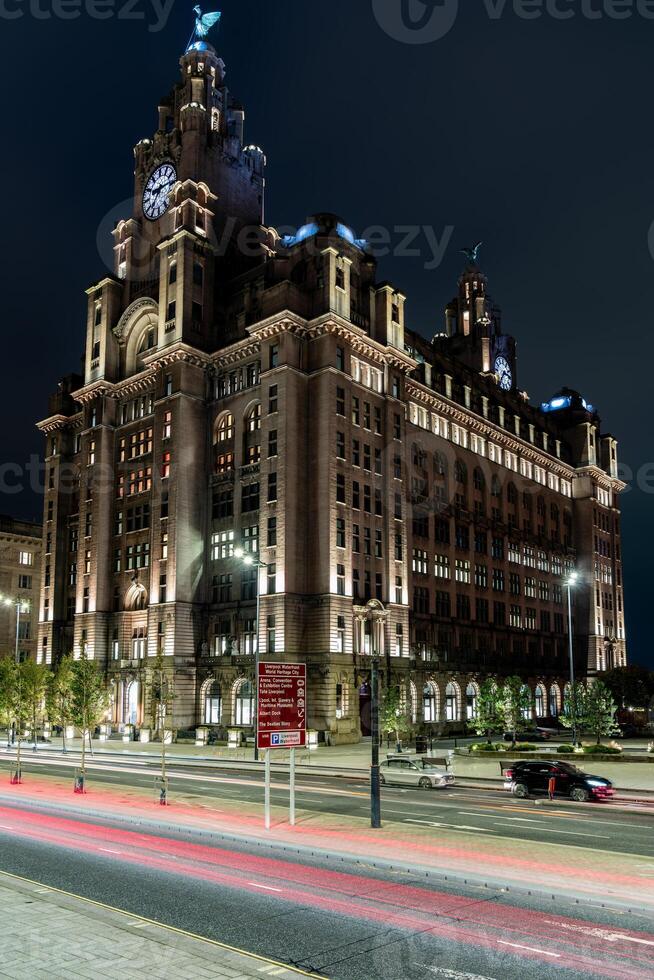 The royal liver building illuminating the liverpool skyline at night photo