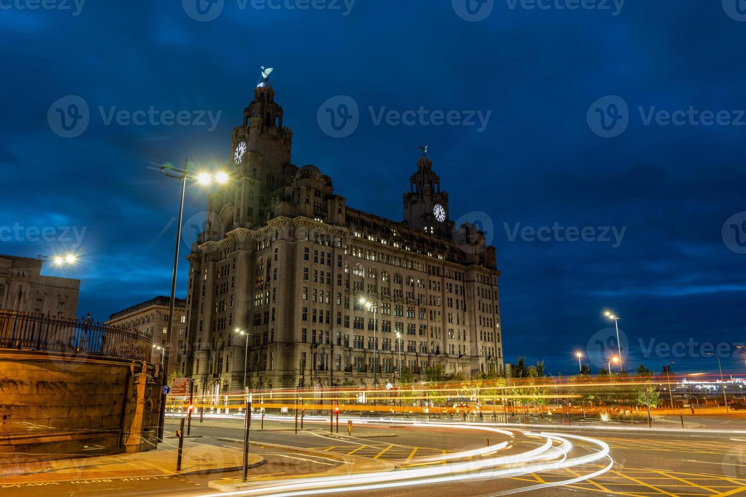 The royal liver building illuminating the night sky in liverpool photo