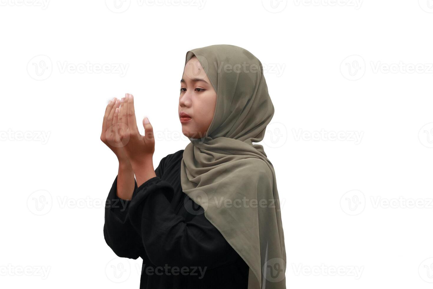 Muslim Woman in Hijab Praying with Open Hands in Devotion photo