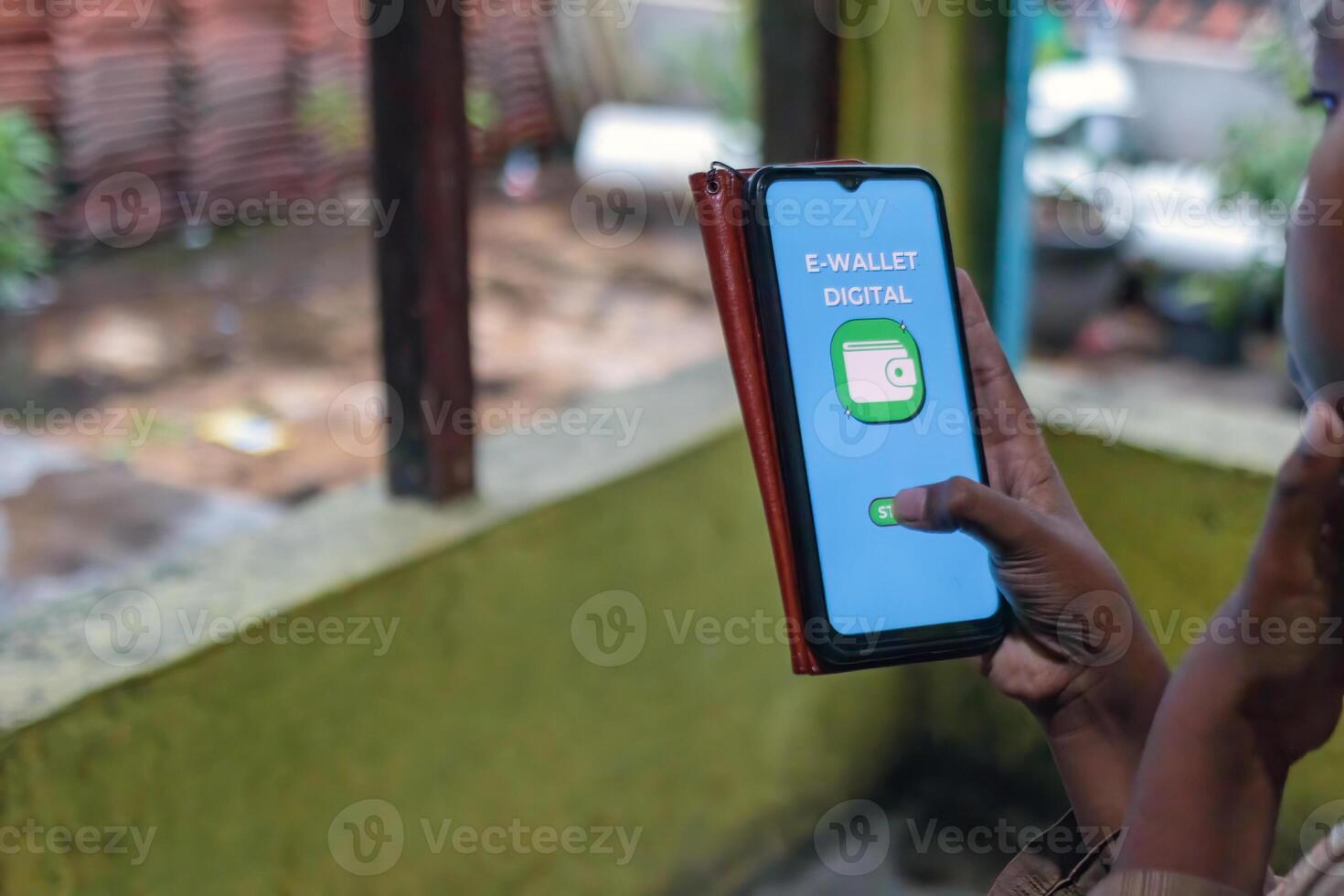 Hand Holding Smartphone Using Digital E Wallet App Outdoors photo