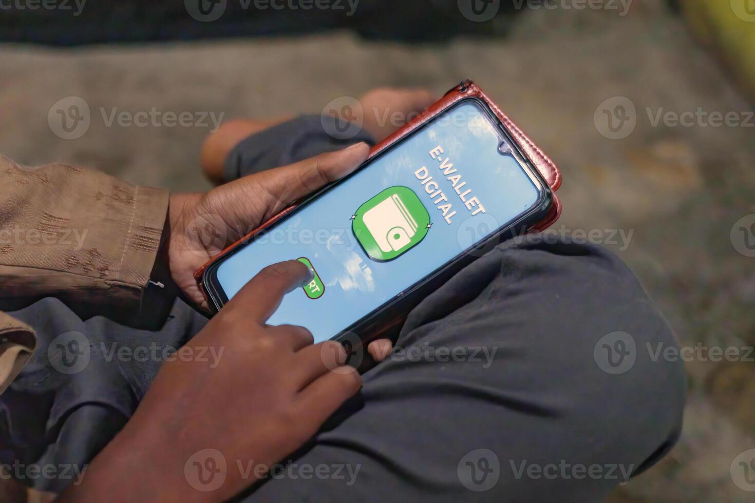 Young Boy Using Digital Wallet App on Smartphone for Online Transaction photo