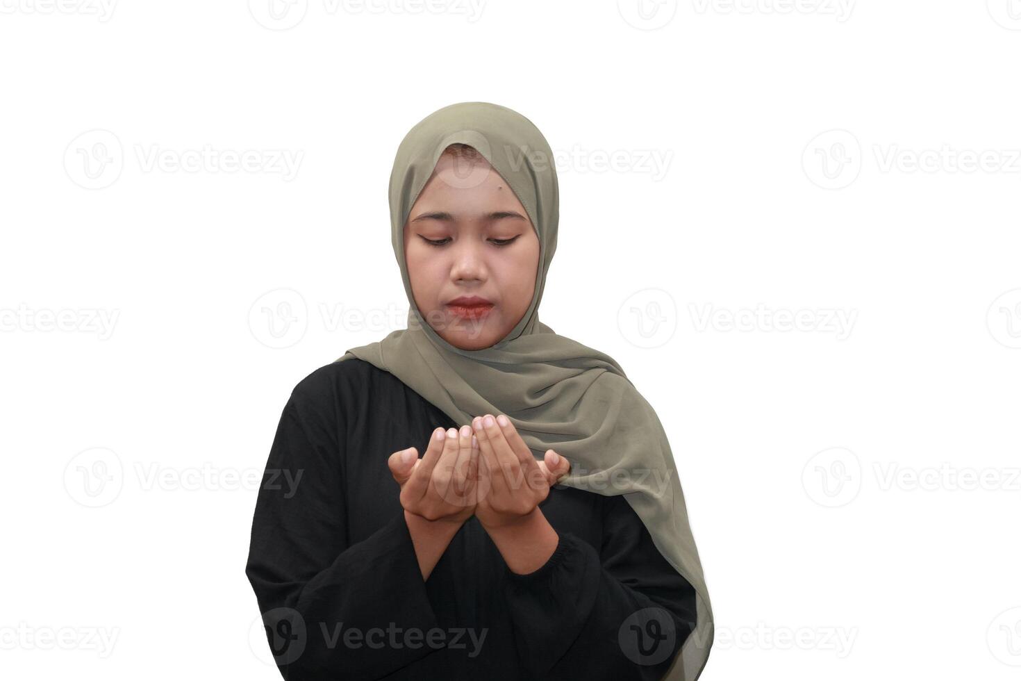Muslim Woman in Hijab Praying with Open Hands photo