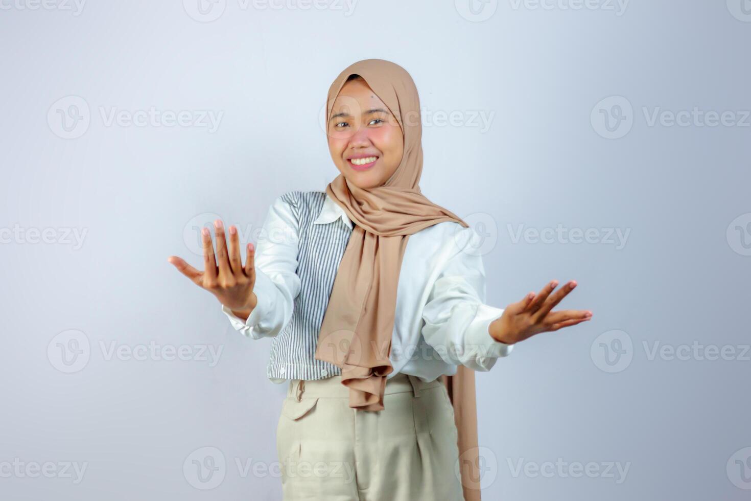 Cheerful Muslim Woman in Hijab with Open Hands Gesture photo