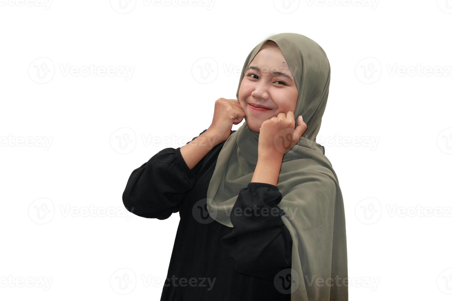 Cheerful Muslim Woman in Hijab Smiling Playfully photo