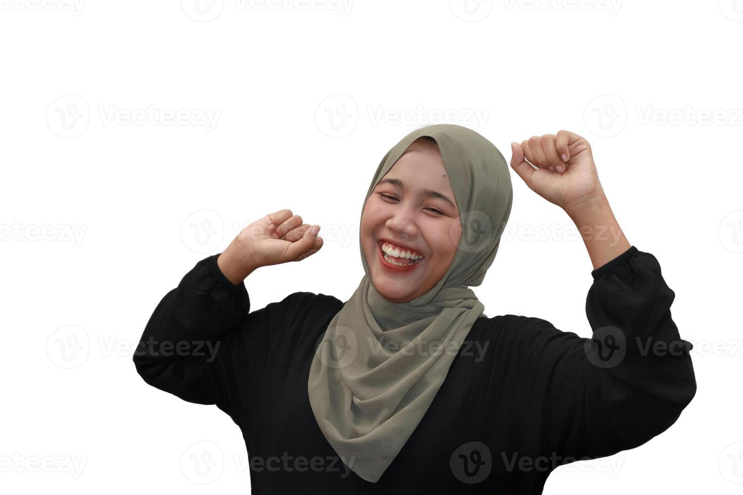 Cheerful Woman in Hijab Raising Hands Isolated on White photo