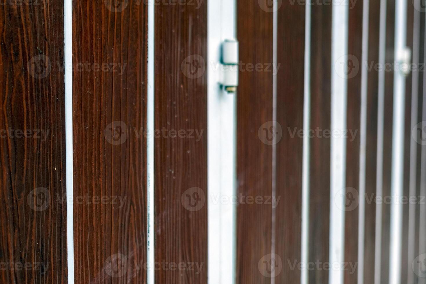 Wooden Folding Gate with Metal Lock Detail photo