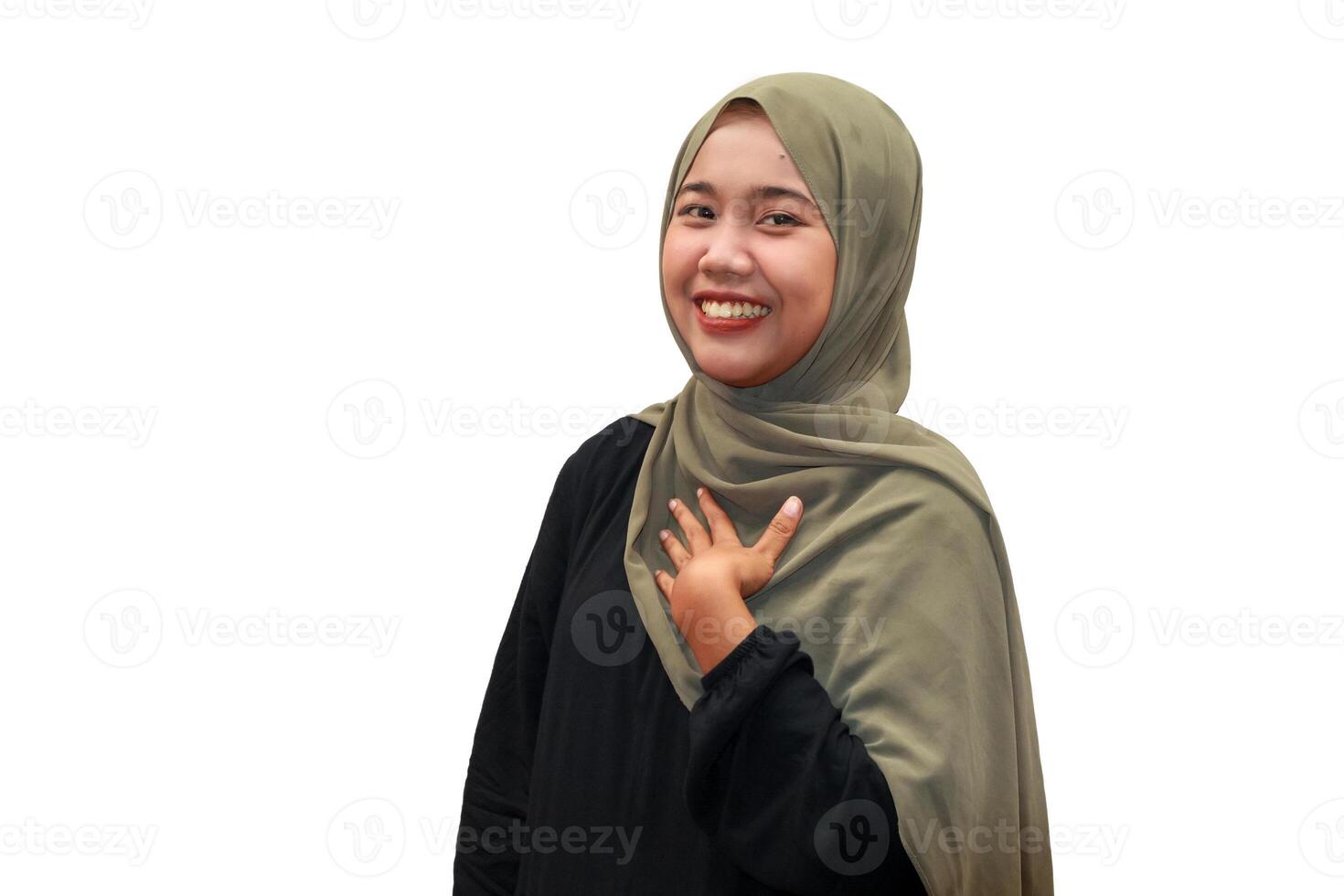 A cheerful Muslim woman in a hijab smiling confidently photo