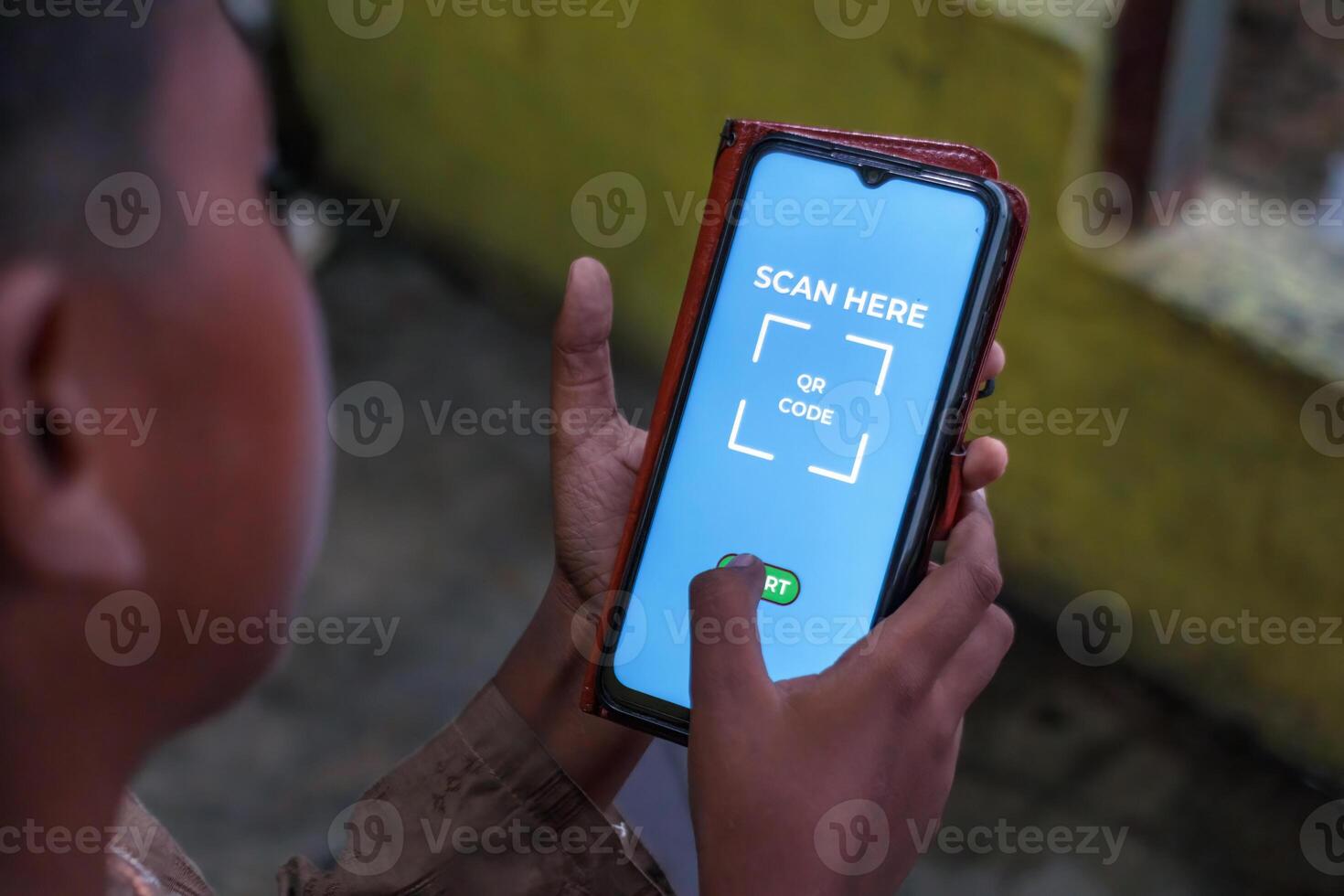 Child Scanning QR Code on Smartphone for Digital Payment photo